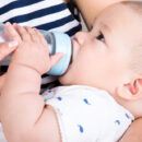 Baby drinking from a bottle