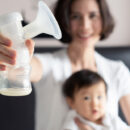 Woman holding a breast pump