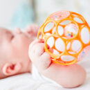 Baby holding a toy